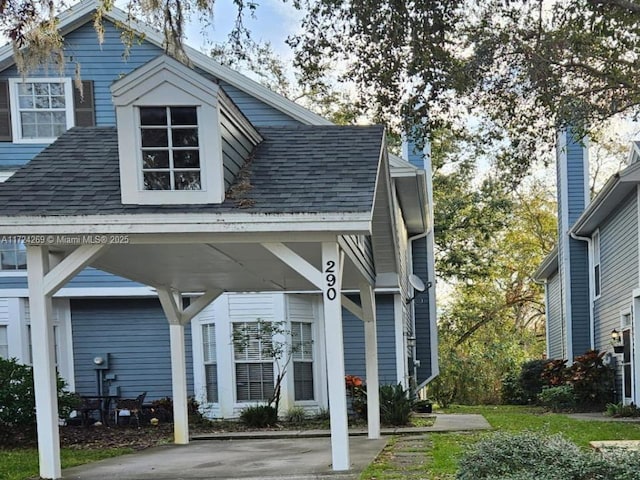 view of front of home with a carport