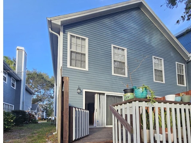 back of house featuring a deck