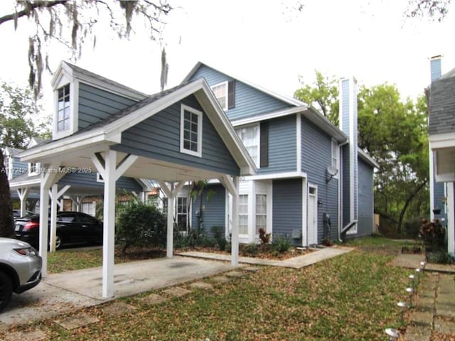 view of front of property with a carport