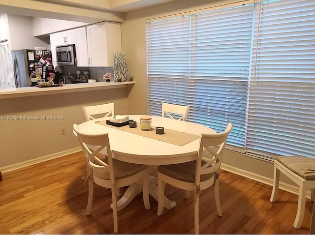 dining room featuring light wood-type flooring