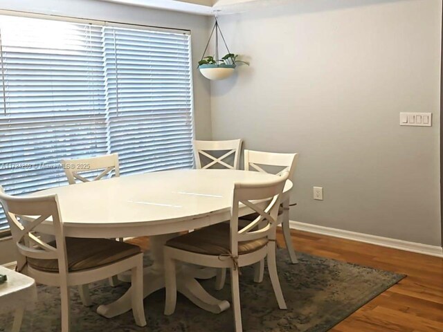 dining area with hardwood / wood-style floors