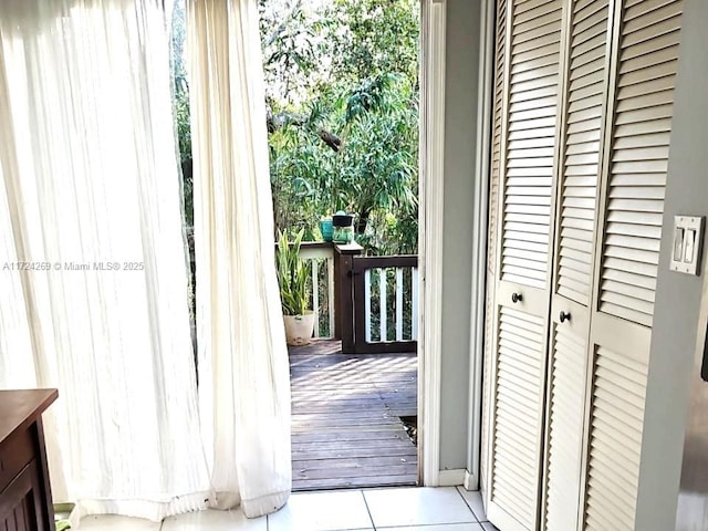 doorway featuring light tile patterned floors