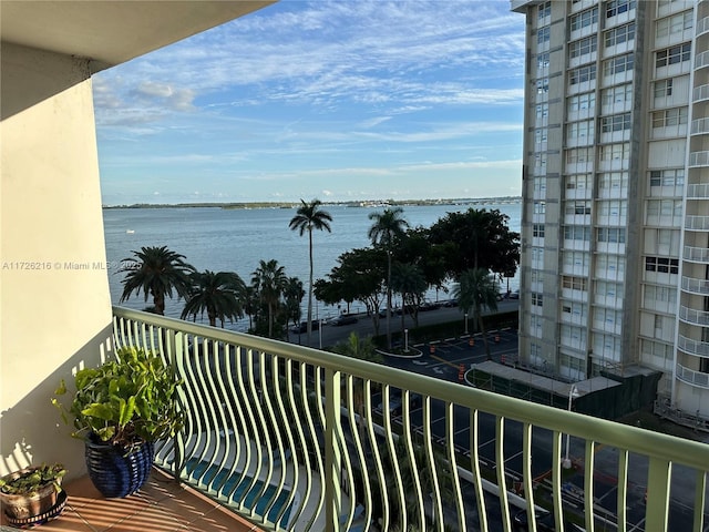 balcony featuring a water view