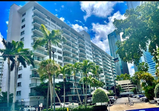 view of building exterior with fence