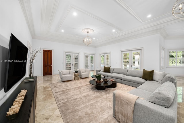 living room featuring ornamental molding and a notable chandelier