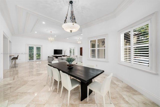 dining room featuring french doors and crown molding