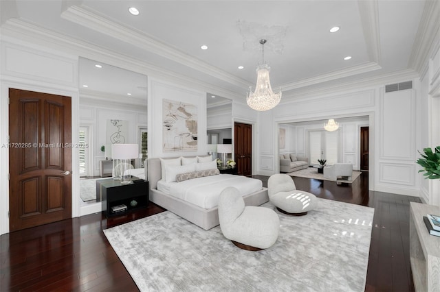 bedroom featuring dark wood-type flooring, crown molding, and an inviting chandelier