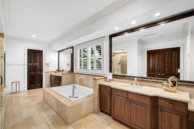 bathroom featuring vanity, ornamental molding, and separate shower and tub