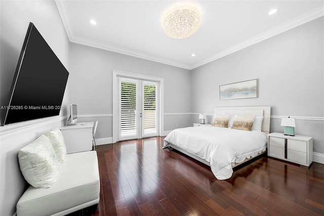 bedroom featuring dark wood-type flooring, ornamental molding, and french doors