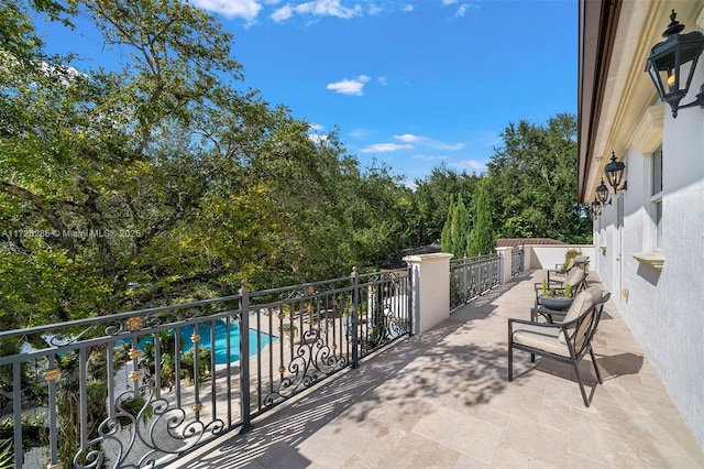 view of patio / terrace featuring a fenced in pool