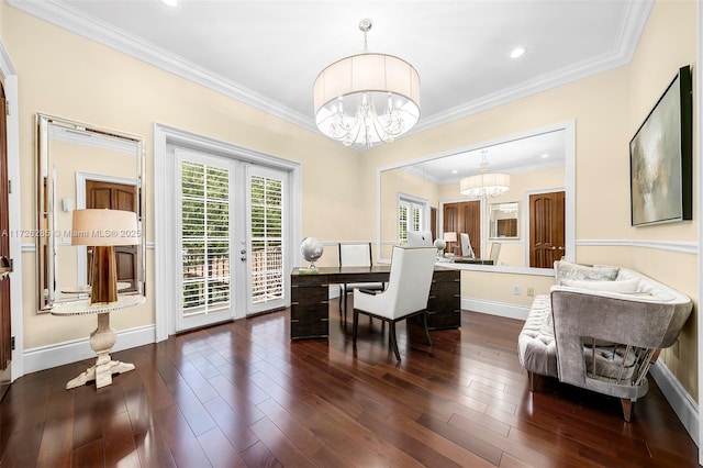 dining area featuring dark wood-type flooring, french doors, ornamental molding, and a chandelier