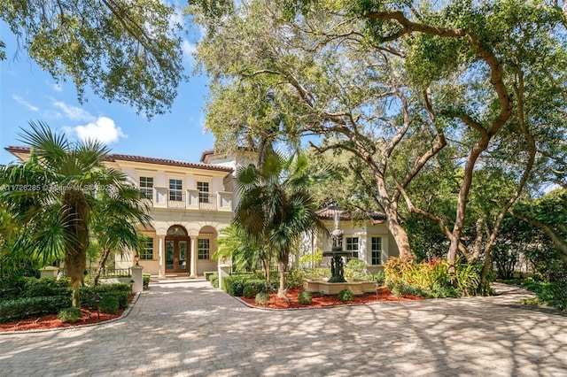 mediterranean / spanish-style house with a balcony