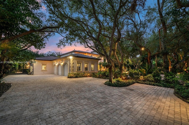 mediterranean / spanish-style house featuring a garage