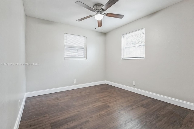 unfurnished room with dark hardwood / wood-style flooring and ceiling fan