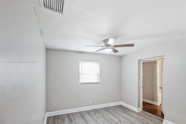 unfurnished room featuring ceiling fan and light hardwood / wood-style flooring