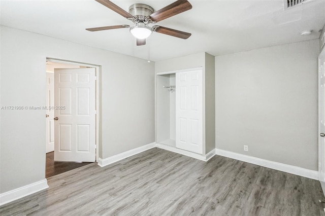 unfurnished bedroom with a closet, ceiling fan, and light hardwood / wood-style floors