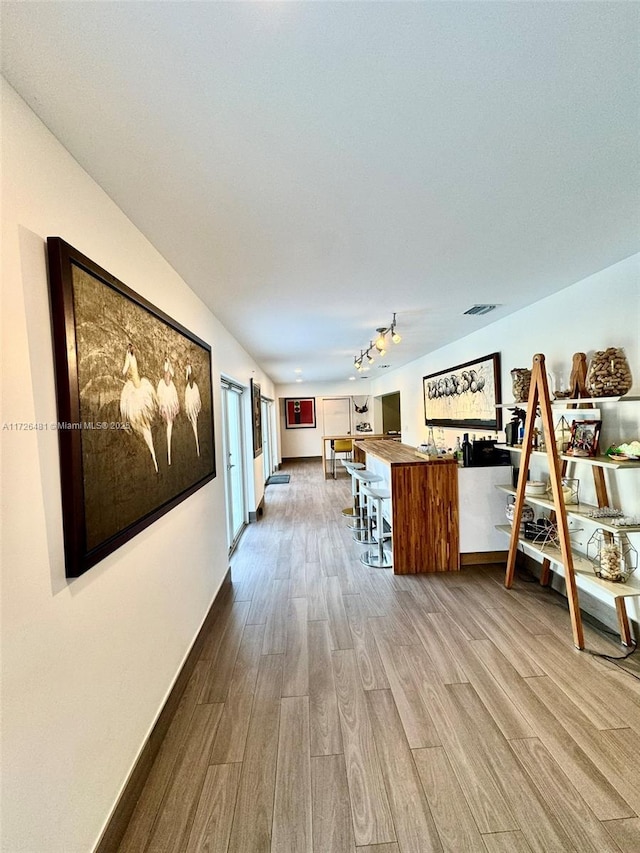 unfurnished living room with light hardwood / wood-style floors