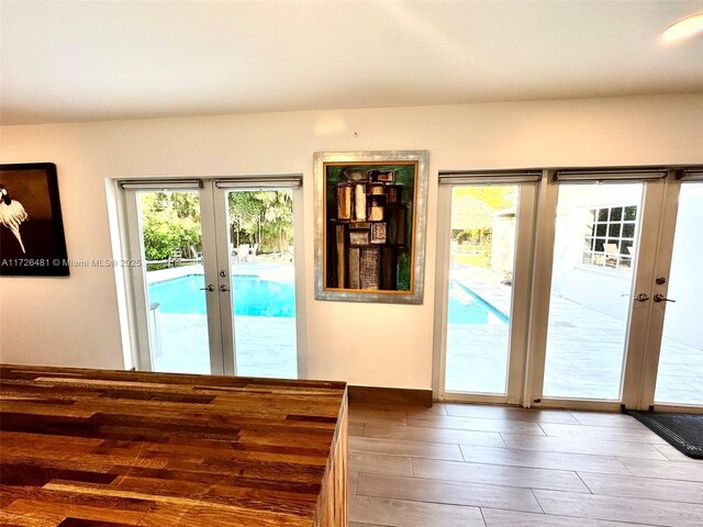 doorway to outside featuring wood-type flooring and french doors