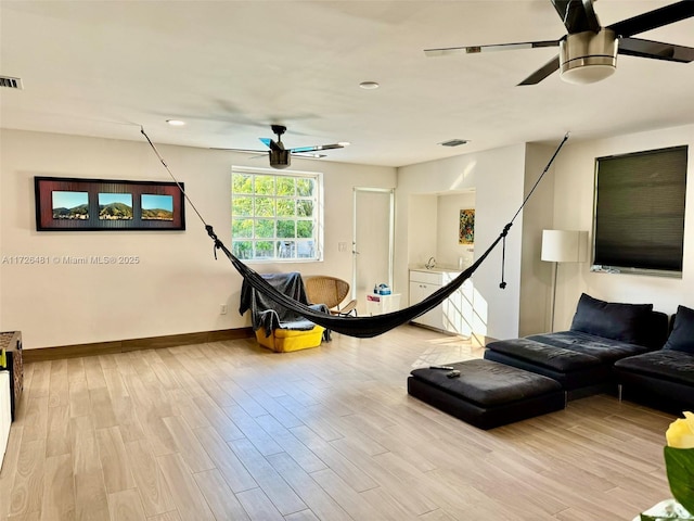 workout room featuring light hardwood / wood-style flooring