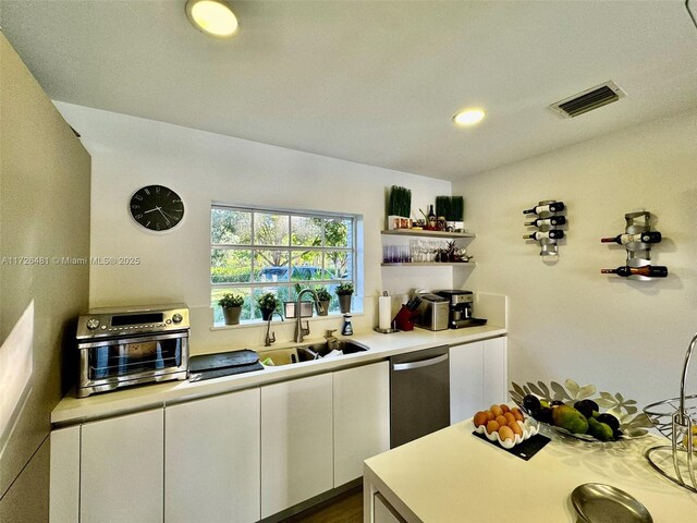 workout area with ceiling fan and light hardwood / wood-style flooring