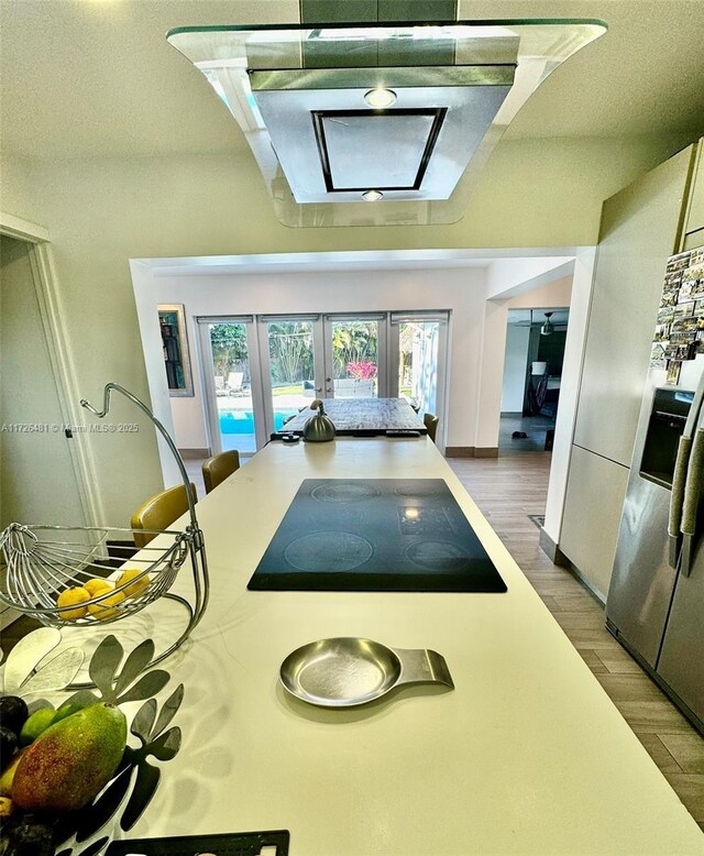 dining area with dark hardwood / wood-style floors and french doors