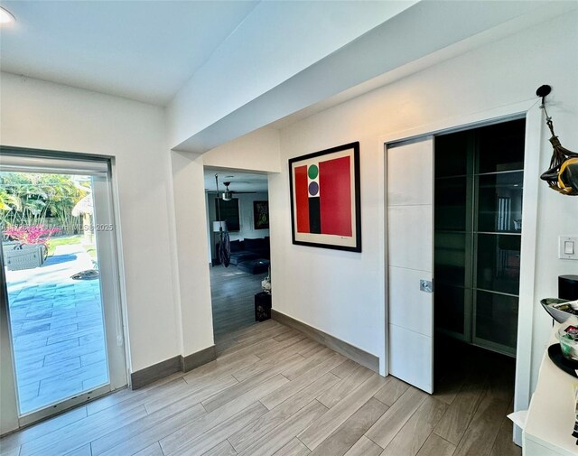 bar with french doors and hardwood / wood-style floors