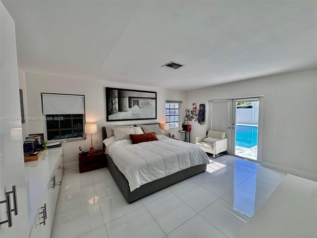 bedroom featuring light tile patterned floors