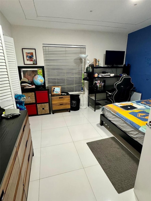 bedroom with light tile patterned flooring