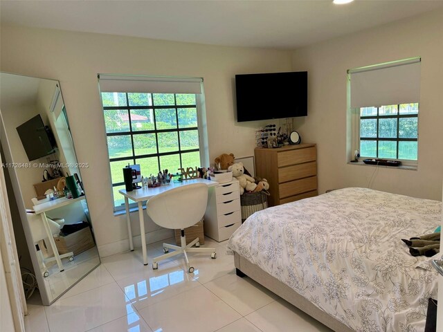 bedroom featuring light tile patterned flooring