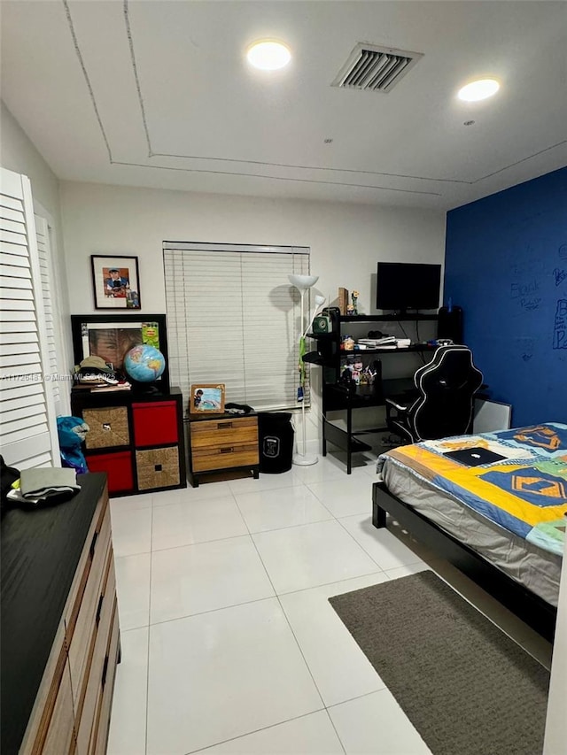 bedroom featuring light tile patterned floors