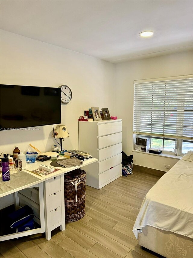 bedroom featuring light tile patterned floors and multiple windows