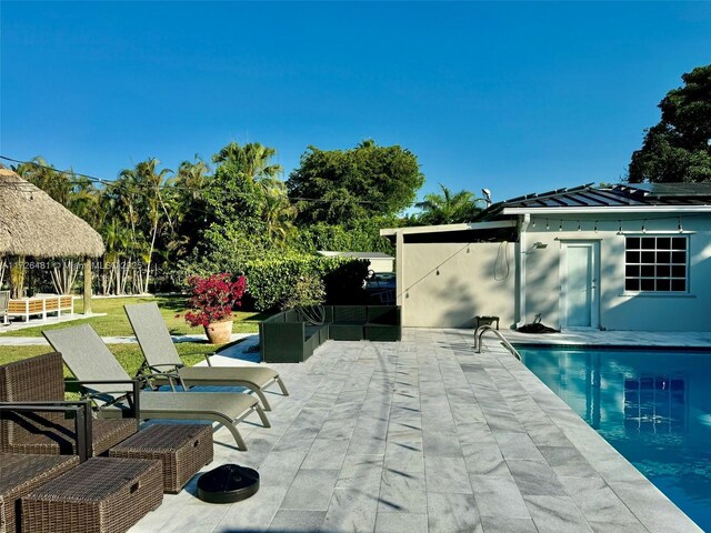 view of swimming pool featuring a patio