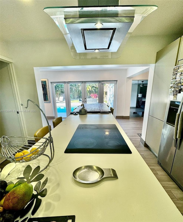 interior space featuring french doors and dark hardwood / wood-style flooring