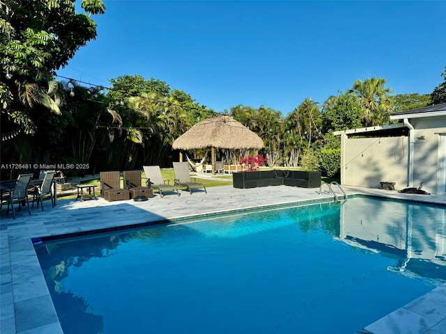 view of pool featuring a patio area, a gazebo, and an outdoor hangout area