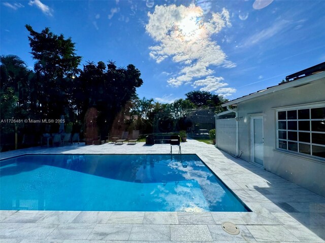 view of pool with a patio