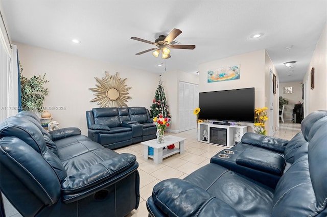 tiled living room featuring ceiling fan