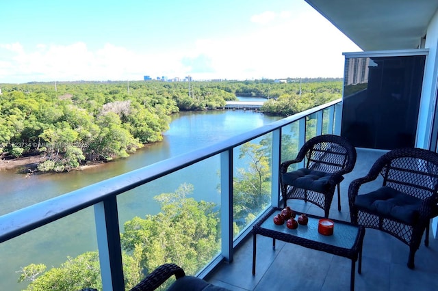 balcony featuring a water view