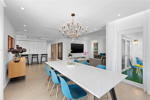 dining area featuring light tile patterned floors and a notable chandelier