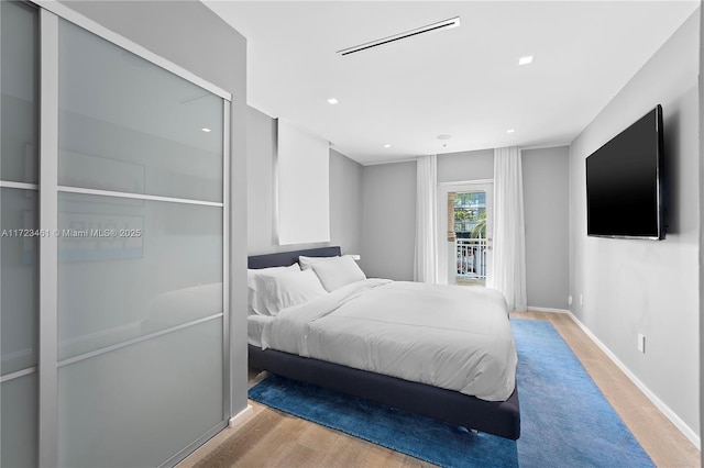 bedroom with light hardwood / wood-style flooring