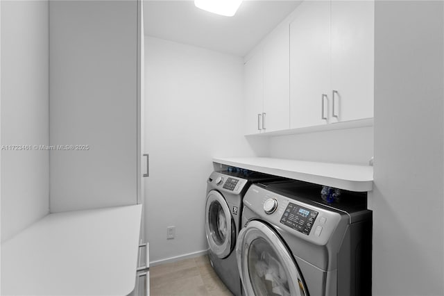 laundry room with cabinets and independent washer and dryer