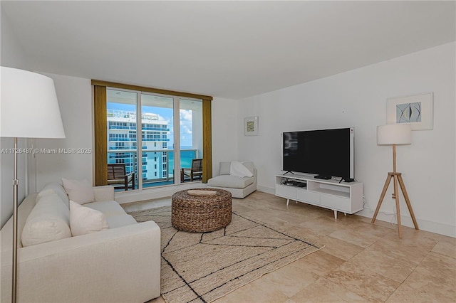 2301 Collins Ave Unit 1515, Miami Beach, FL 33139 - living area featuring stone finish flooring and baseboards