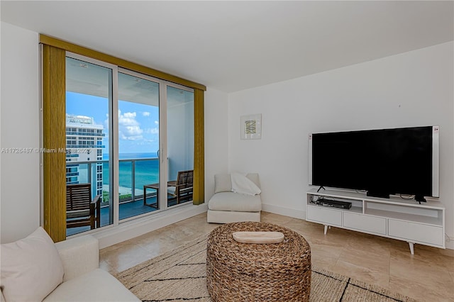 living room featuring floor to ceiling windows