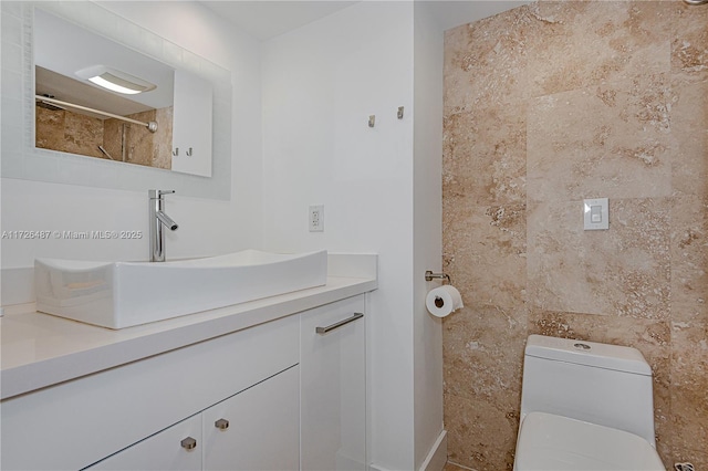 bathroom with toilet and vanity