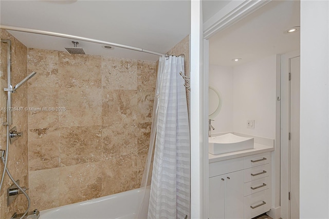 bathroom featuring vanity and shower / bath combo with shower curtain