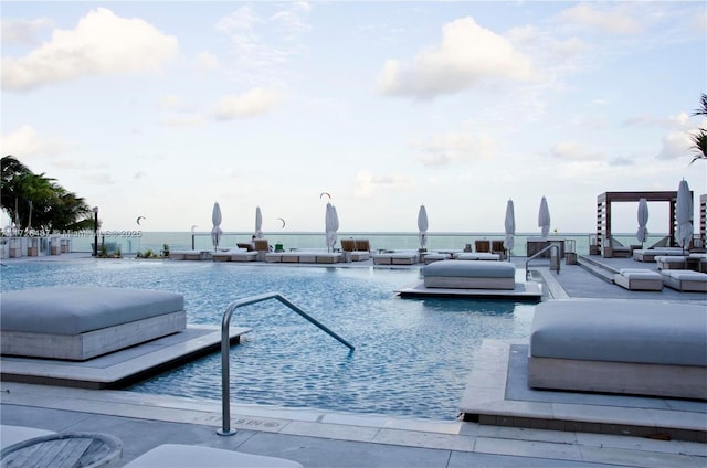 2301 Collins Ave Unit 1515, Miami Beach, FL 33139 - view of pool with a water view and a hot tub