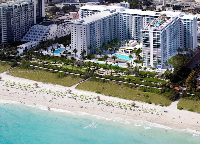 aerial view with a view of the beach and a water view