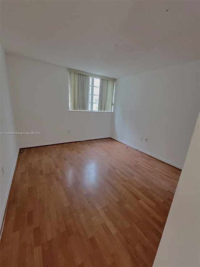 empty room with light wood-type flooring