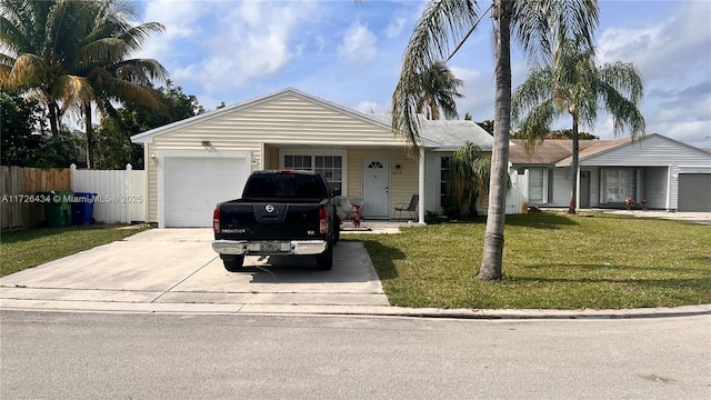 ranch-style house with a garage and a front yard