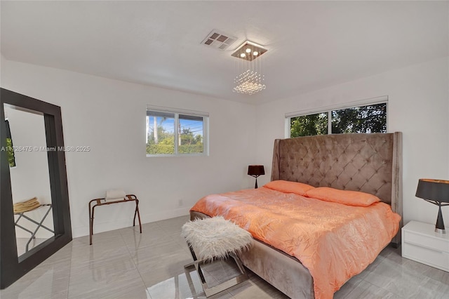 bedroom featuring a chandelier