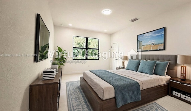 bedroom with light tile patterned floors